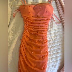 XS mini coral colored dress with faux pearls.
